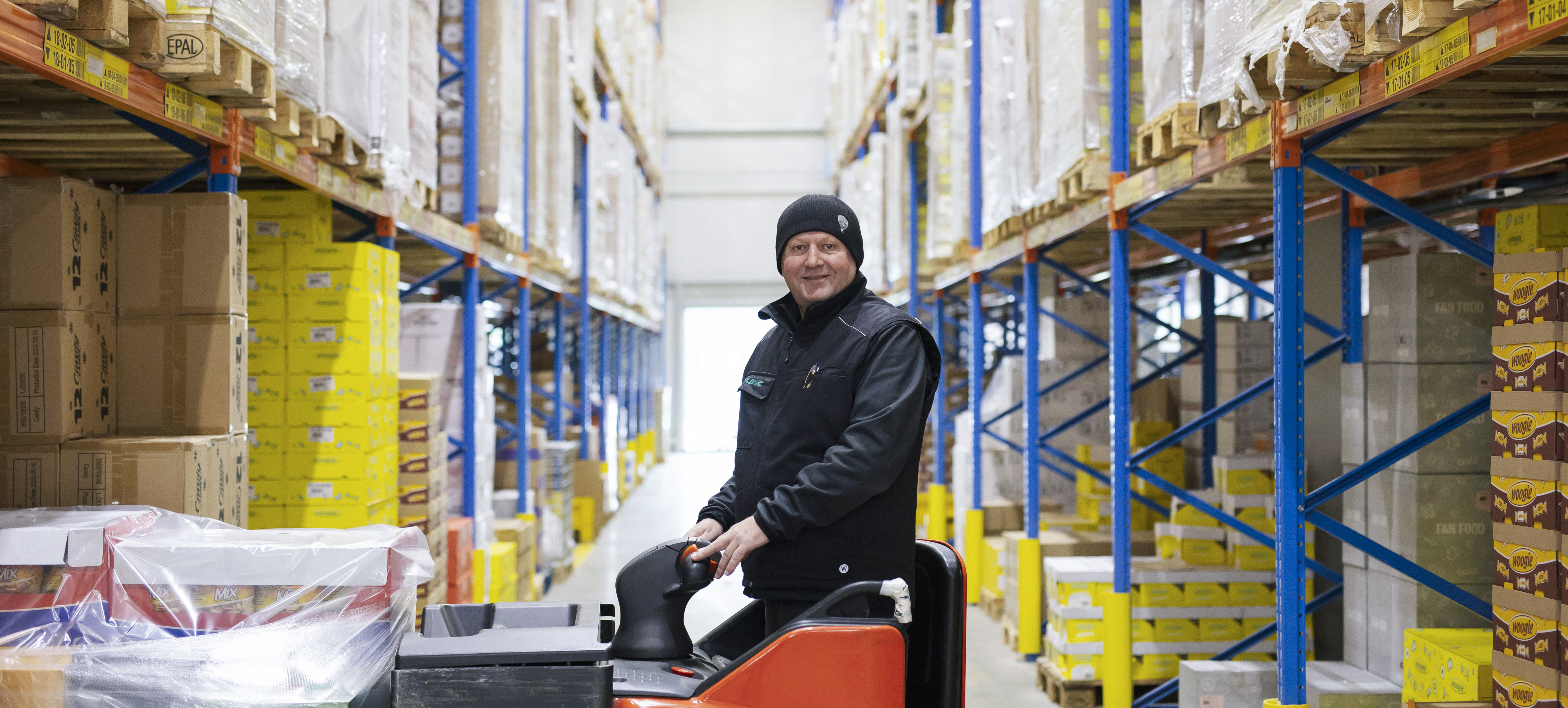 Colleague loading in the warehouse aisle