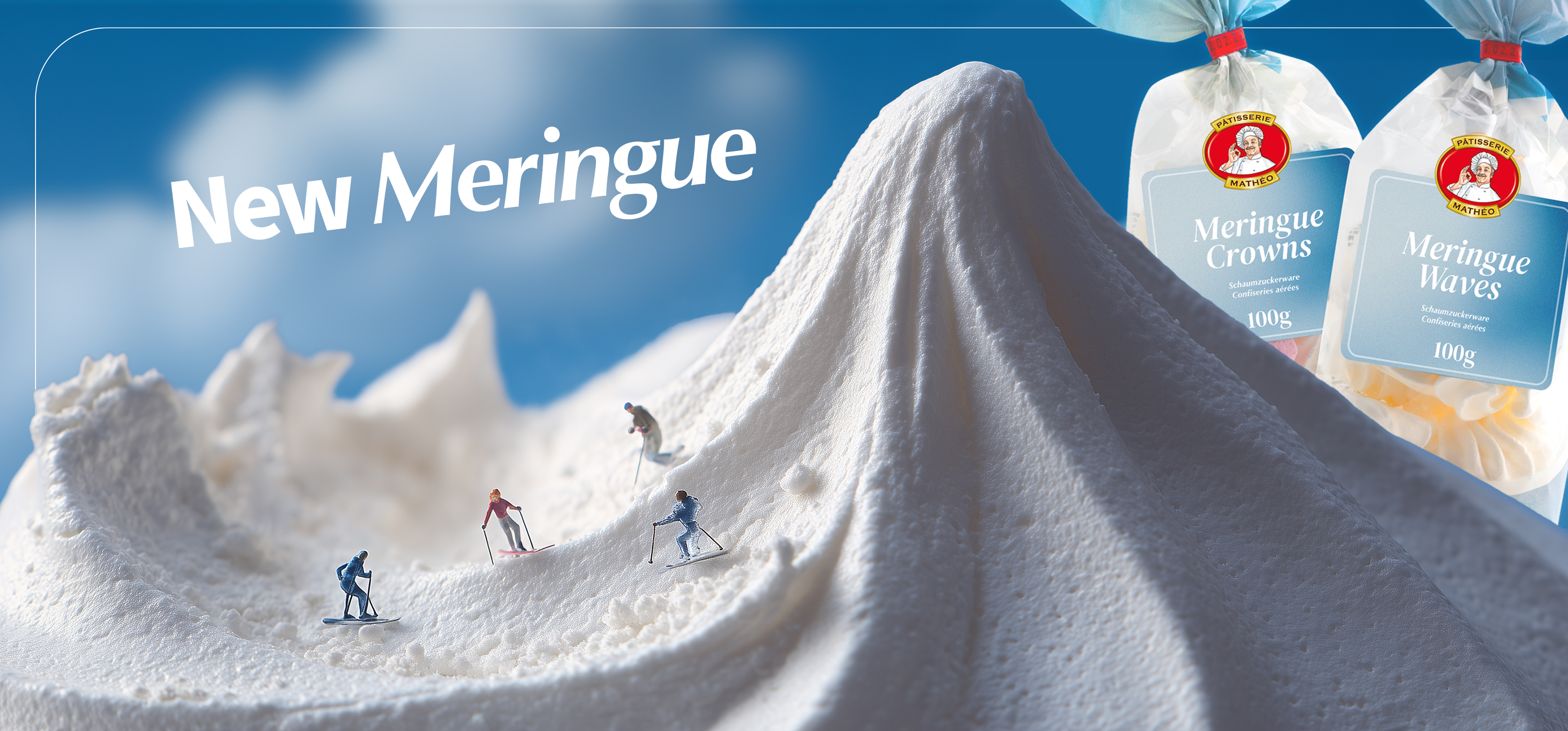 Advertising image &ldquo;New Meringue&rdquo;: meringue mountains as snow with miniature skiers, alongside product packaging
