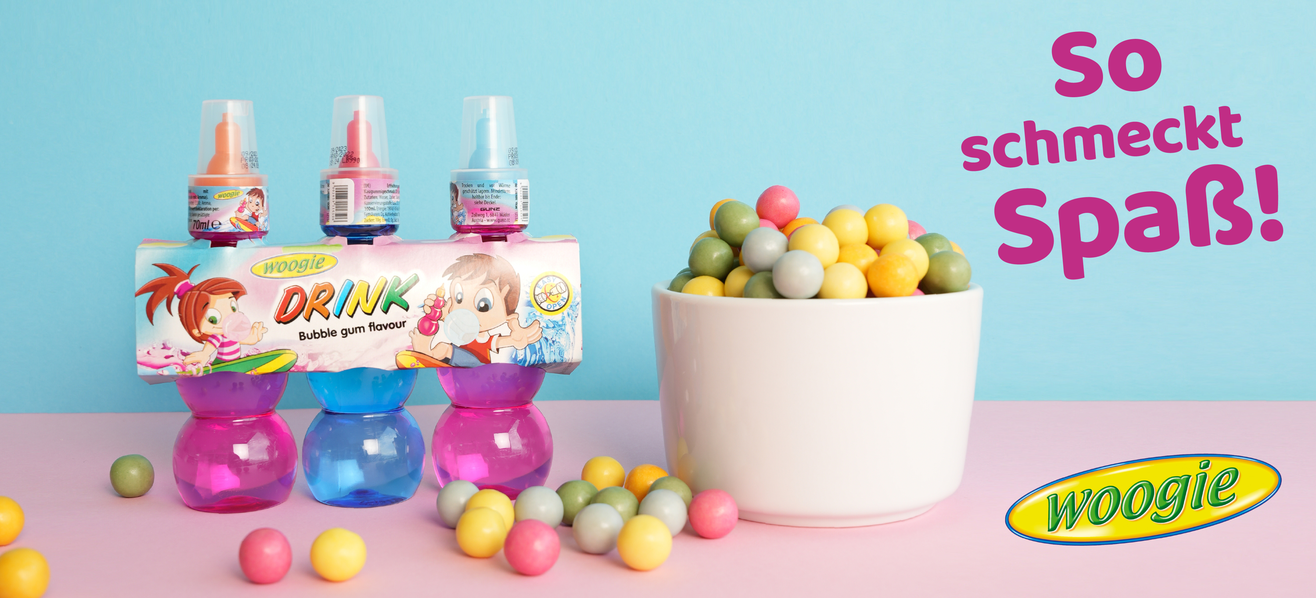 3 Woogie Bubblegum-Flaschen mit bunten Kaugummikugeln und Spruch „So schmeckt Spaß!“